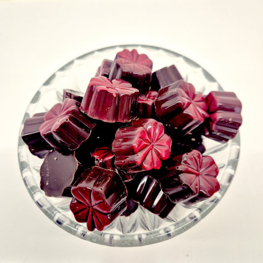 Praline - Klavertje vier puur gevuld met framboosganache